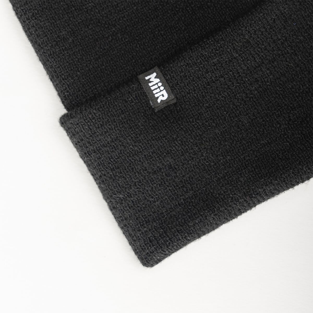 recycled-poly-fine-knit-beanie-h9 WebPDP-RecycledPolyFineKnitBeanie_Studio_TagDetail_Black__BNE005002OS.jpg