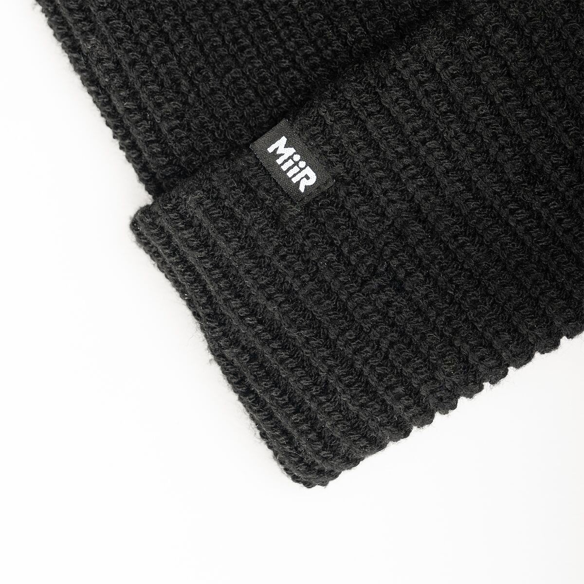 recycled-poly-rib-beanie-x8 WebPDP-RecycledPolyRibBeanie_Studio_TagDetail_Black__BNE002002OS.jpg
